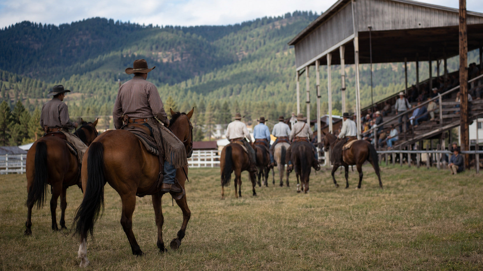 Western riders entering a grass rodeo arena in Pendleton, Oregon