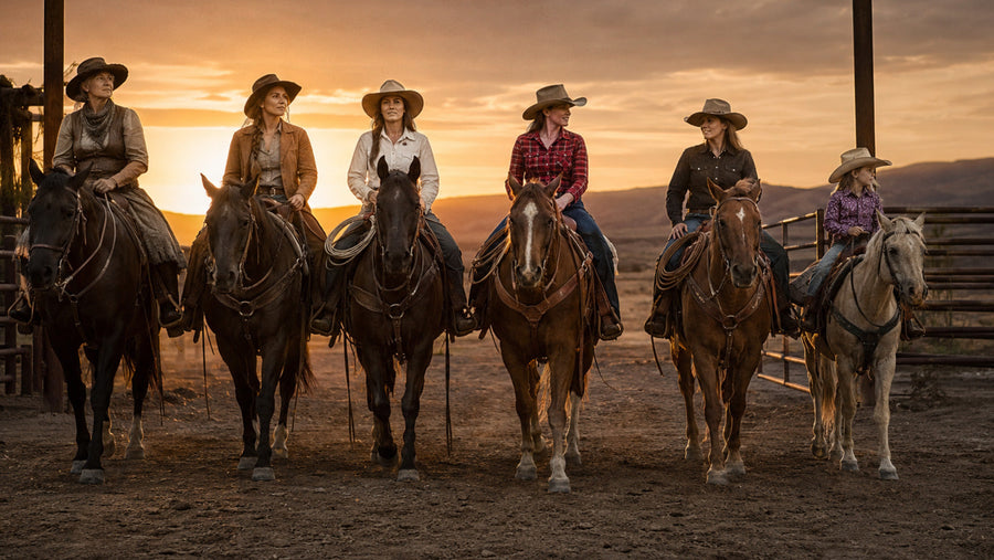 Multi-generation group of women rodeo riders entering an arena together at sunset