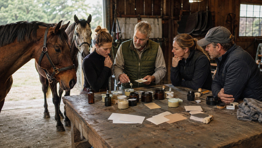 Riders and a product developer reviewing unbranded horse-care samples