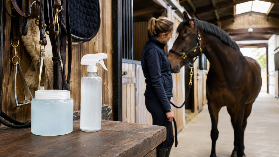 Plain gel and liquid liniment containers on a tack-room workbench